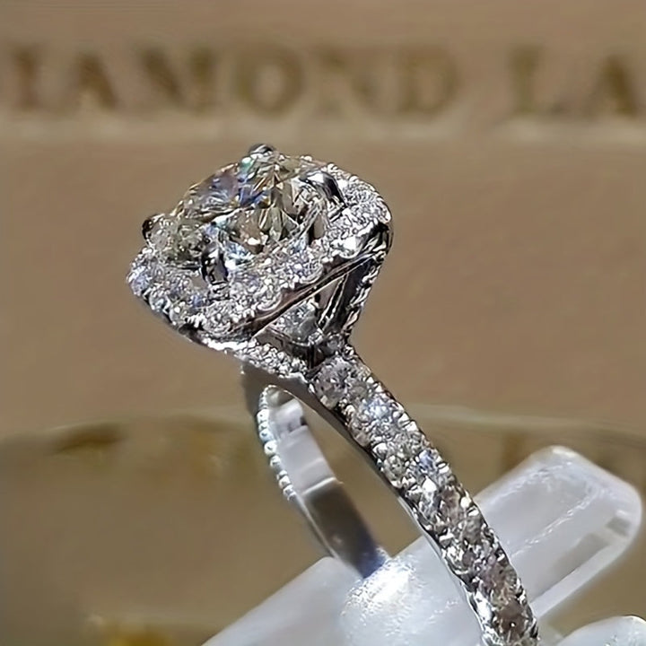 White gold ring with embedded zirconia stone