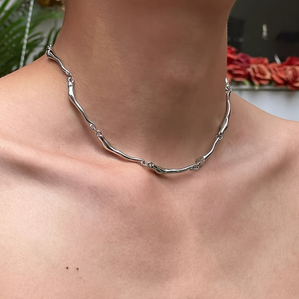 White Gold Necklace with Twisted Wave Design