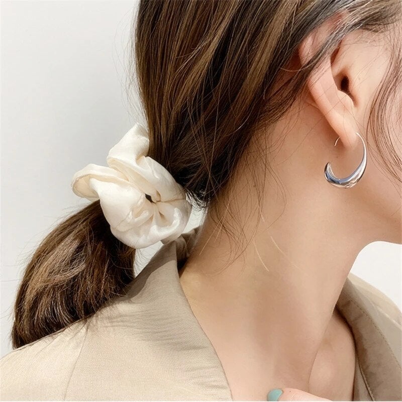 Luxury earrings in gold and silver