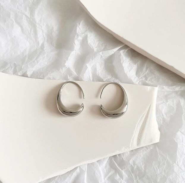 Luxury earrings in gold and silver