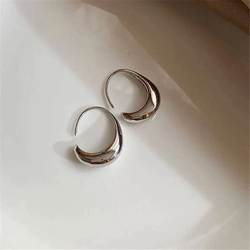 Luxury earrings in gold and silver